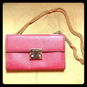 Red Henri bendel wallet on a chain